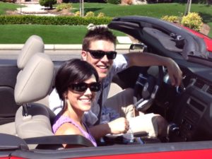 happy couple wearing cocoons fitover sunglasses